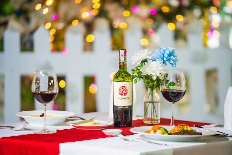 A table set for two with wine and food